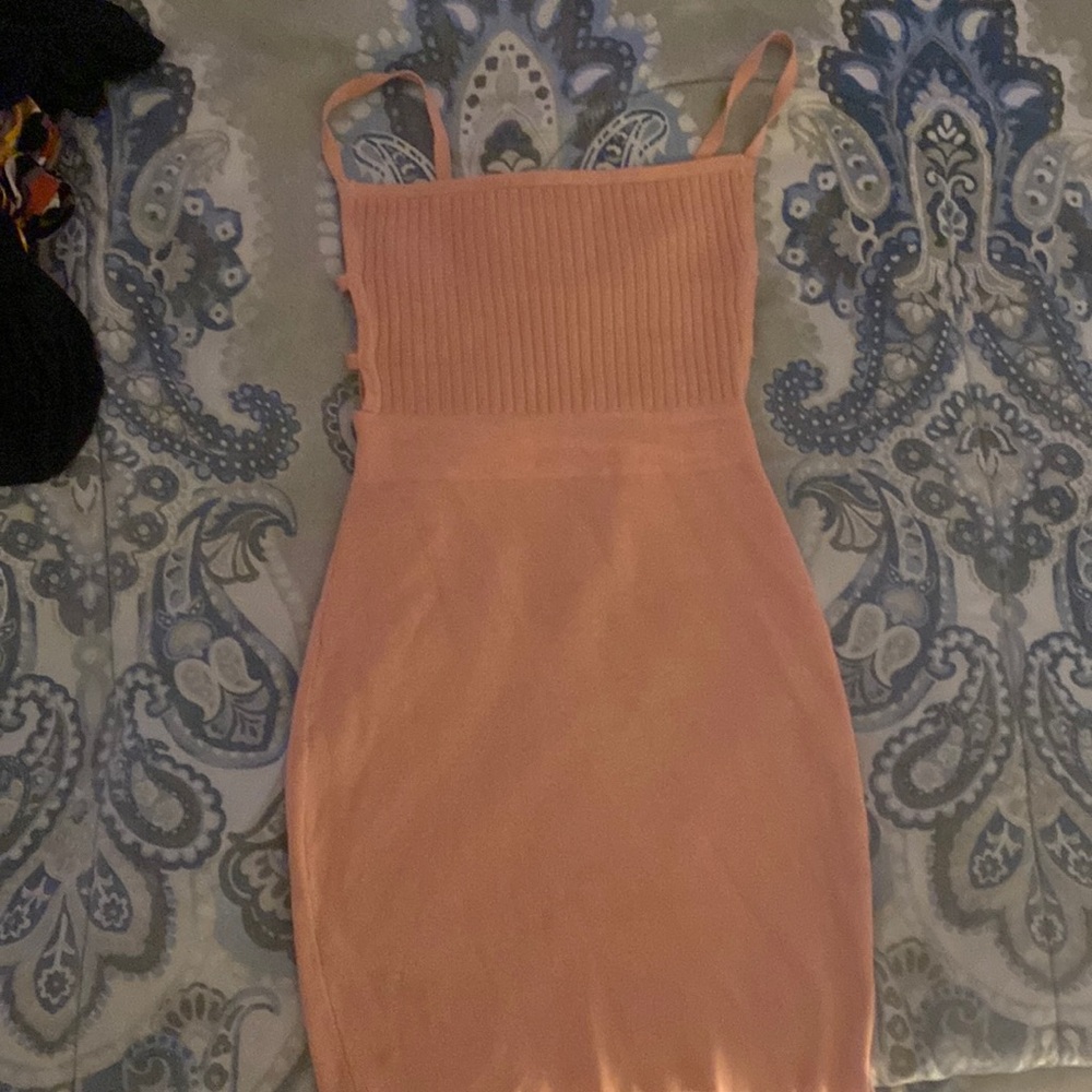 Pink Outwear. Worn twice on dates. Good Condition.